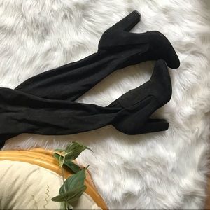 Black knee high heeled suede boots